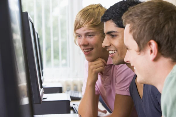 Male college students in a computer lab 
